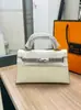 Elegante bolso Kelly con hebilla plateada y estampado de palmas, nueva moda 2026, bolso de mano para mujer, segunda generación, 22 cm, bolso de hombro cruzado