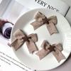 Nuevos accesorios de otoño e invierno de estrella marrón con lazo accesorios para el cabello accesorios de tela zapatos bolsos accesorios de ropa al por mayor