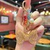 Llavero de Moño Elegante y de Alta Gama Incrustado con Diamantes y Exquisitas Cuentas de Cristal de Colores, un Accesorio Decorativo para Bolsos de Mujer