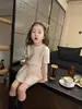 Roupa Infantil Estilo Coreano 2026 Verão Novo Estilo Meninas Cor Sólida Padrão Torcido Gola Redonda Malha Manga Curta Saia Plissada Conjunto