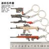Arma devoradora de pollos periférica mini MK14awm 98K Glock sks rueda izquierda m416 juguete llavero traje