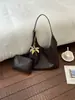 Bolso de axila de alta gama para mujer 2026 nuevo de moda tejido patrón vintage de un solo hombro bolso madre-hija transfronterizo
