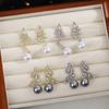 Pendientes de perlas de alta gama, sencillos, ligeros y de lujo, de estilo coreano con aguja plateada y diseño de nicho, con alas asimétricas y diamantes.