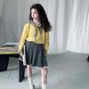 Traje de estilo universitario de primavera y otoño para niñas 2025, nueva ropa de primavera para niños, suéter de punto para niñas, falda plisada, top de dos piezas