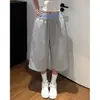 Shorts esportivos de retalhos em cores contrastantes para mulheres são populares este ano, apresentando um design simples, solto e que afina a silhueta para pessoas baixinhas, calças casuais cropped de perna larga.