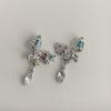 ¡Diablo! Aretes de flores de metal líquido de moda nicho viento frío aretes moda temperamento aretes ins