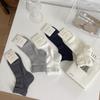 Calcetines básicos de color sólido japonés con oreja de madera de cinco puntos de tubo corto de encaje sin hueso para mujer al por mayor calcetines simples para mujer que combinan con todo