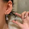 Pendientes de Zirconia Saturno de la Emperatriz Viuda Pendientes Placa de Incienso Mosquitera de Sentido Avanzado Pendientes Sin Agujeros en las Orejas Pendientes de Viento Frío para Mujer