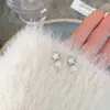 Pendientes de mariposa con perlas y explosiones 2025 para mujer, de alta gama, de nicho, ligeros, de lujo, de plata 925, al por mayor.