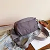 Bolso cruzado de estilo simple para mujer 2026 Nuevo versátil ligero impermeable de nailon para el día a día Bolso de viaje multicapa para teléfono