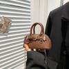 Bolsa Transversal de Corrente de Moda Coreana Transfronteiriça para Mulheres 2025 Nova Bolsa de Ombro Versátil Simples Portátil em Formato de Concha