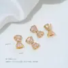 Cuentas Espaciadoras de Cobre Chapado en Oro de 14 Quilates con Forma de Lazo y Agujero Pasante para Accesorios de Pulseras de Cristal y Perlas DIY