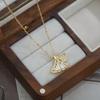 Oro real galvanizado micro incrustado circón elegante cadena clavícula femenina de alta calidad colgante hoja de ginkgo collar personalidad collar versátil