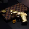Juguete de pollo para comer Águila del Desierto Oro banda elástica aleación arena Águila pistola puede ser continua banda elástica Modelo 13cm