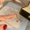 Collar de Nudo de Cuerda Sonriente para Mujer Zirconia Microincrustada Colgante de Nudo de Amor Regalo de Tanabata Cadena para Clavícula de Lujo Ligero de Moda Nicho