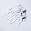 Explosiones transfronterizas Vajilla de acero inoxidable 1010 dorado titanio Cuchillo para bistec, tenedor y cuchara de estilo occidental Juego de regalo de cuatro piezas