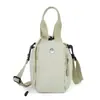 Bolso bandolera de nailon estilo coreano, fresco y versátil, para botella de agua, resistente al agua, moderno, ligero, bolso de hombro portátil, unisex