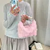 Bolso de mano de malla floral muy atractivo y dulce 2026 verano nueva moda elegante único versátil texturizado con cuentas