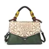Bolsa feminina estilo étnico retrô transfronteiriça 2026 novo modelo bolsa Kelly moda de alta qualidade bolsa de ombro para o dia a dia