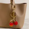 Chaveiro de resina de cereja simulada transfronteiriço da Amazon, acessório de pingente de folha e fruta com gota de óleo estilo pastoral