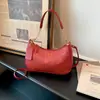 Bolso de axila retro simple para mujer, nuevo modelo 2026, bolso de mano de un solo hombro con sensación de alta gama, bolso de axila con cadena, versátil para el trabajo