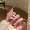 Brincos de Coração de Renda com Zircônia Cúbica Estilo Coreano e Pérola para Mulheres 2026 Novos Brincos de Tarraxa Super Bonitos Design de Nicho Joias para Orelha