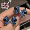 Nuevos y exquisitos pendientes de lazo de diamante azul de circón microincrustado con sentido tridimensional, muy buenos para el temperamento, diseño de nicho versátil