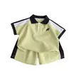 Conjunto de verano de manga corta para niños, ropa de verano nueva, POLO de bloques de color, elegante conjunto de dos piezas para niños y bebés, fresco y moderno