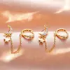 Fio de orelha com franja de corrente estrela de cinco pontas incrustada com diamante banhado a ouro 18k brincos de tarraxa estilo INS popular na Europa e América brincos de lua com zircônia