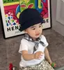 Traje Estilo Coreano para Niños 2026 Verano Nuevo Estilo Infantil Elegante Camiseta Blanca de Manga Corta Pantalones Anchos con Estampado de Leopardo Conjunto de Dos Piezas