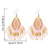 Pendientes bohemios étnicos retro transfronterizos con cuentas de arroz MGB y borlas de diamantes tejidas a mano para mujer