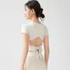Conjunto de ropa de yoga para entrenamiento de Pilates, hermoso top de manga corta de yoga con espalda descubierta para mujer, falda deportiva plisada de tenis anti-exposición