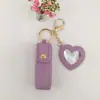 Bolsa de Batom Popular Portátil Transfronteiriça Chaveiro com Pingente de Couro Acessório Bolsa de Armazenamento de Batom Mini Espelho em Forma de Coração