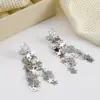 Atmósfera de Otoño e Invierno Estrella Plateada Borla Clip para Oreja Sin Perforar para Mujer Diseño de Nicho Pendientes Elegantes Versátiles de Alta Gama