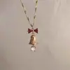 Escuché que las hojas de arce son la confesión más cálida del otoño~Cadena de suéter simple y versátil de color rojo, accesorio colgante de alta gama
