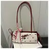 Bolsa de axila de seersucker dulce y fresca 2025 estilo de Hong Kong Bolso de hombro casual con lazo Bolso de hombro tipo bandolera simple y moderno