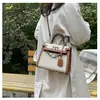Bolsos estilo nuevo candado bolso Kelly, bolso de mano de moda europeo y americano con bloques de color para mujer, bolso cruzado de hombro texturizado y empalmado