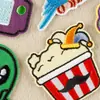 Nuevos y peculiares parches bordados de dibujos animados con lindos diseños de consolas de videojuegos alienígenas, perfectos para decoración DIY y aplicación termoadhesiva; disponible al por mayor