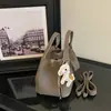 Bolso de mano para mujer transfronterizo, nueva colección otoño 2026, bolso tipo cubo moderno y a la moda, bolso de hombro y bolso cruzado versátil