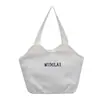 Bolso de mano simple y casual estilo coreano y japonés, bolso de lona plisada versátil, moderno y artístico para el trabajo, los desplazamientos y para guardar la lonchera.