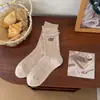 Calcetines bordados de dibujos animados para mujer, otoño e invierno, estilo preppy, de longitud media hasta la pantorrilla, estilo japonés con bordes enrollados, con lindos diseños de letras y cachorros, sin costuras y afelpados