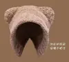 Otoño e invierno nuevo lindo oso sombrero cálido protección facial orejas pequeñas sombrero de lana sombrero de invierno japonés y coreano sombrero de punto versátil