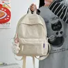 Mochila Simples Estilo Japonês para Mulheres 2026 Nova Bolsa Casual Estilo Ins de Duas Alças para Alunos do Ensino Fundamental II e Médio