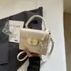 Bolso pequeño rosa a cuadros súper popular para mujer, nuevo bolso cruzado versátil de moda 2026, bolso cuadrado pequeño informal tipo caja estilo coreano
