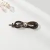 Bowknot Elegant Pearl One Word Grab Clip Feminino 2024 Novo High-end Sense Twisted Hairpin Back Head Shark Clip