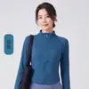 La popular ropa de yoga para mujer de este año, sudadera de manga larga con media cremallera y cuello alto a la moda, camiseta versátil y a la moda con dobladillo curvo
