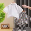 2025 Nueva Moda Verano para Bebés y Niños Ropa Camisa de Lazo Manga Corta Dos Piezas Traje de Verano para Niño