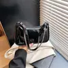 Bolso pequeño transfronterizo estilo retro para mujer, nuevo bolso casual de color liso para otoño 2026, moderno bolso de hombro y cruzado