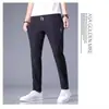 Fabricante transfronterizo de comercio exterior al por mayor de pantalones deportivos casuales de verano de talla grande de secado rápido para hombre, pantalones rectos holgados transpirables de seda de hielo
