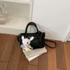 Bolsa feminina quadrada pequena modelo novo primavera 2026, bolsa de mão amarela de alta qualidade com padrão de lichia, bolsa de ombro e transversal doce estilo coreano